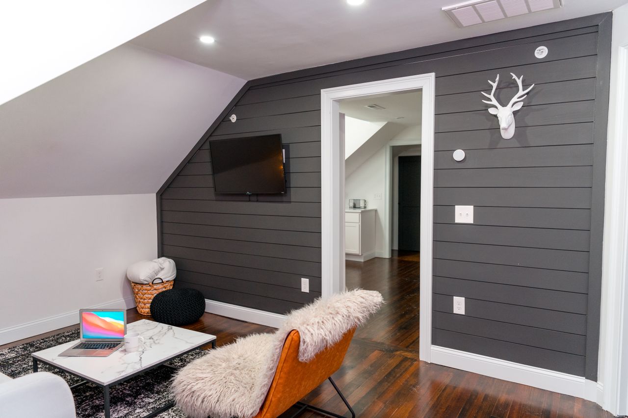 Stylish loft space featuring modern decor and faux fur accents in a cozy setting.
